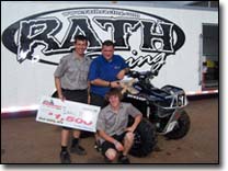 Daryl Rath and crew besides their Suzuki King Quad 700 ATV